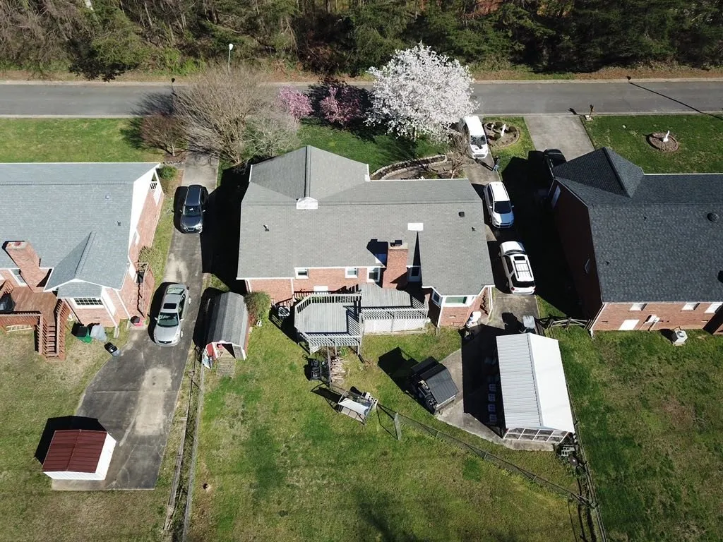 aerial view with greenhouse in backyard