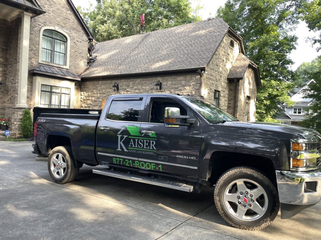 Kaiser Truck in front of Roofing Project home.